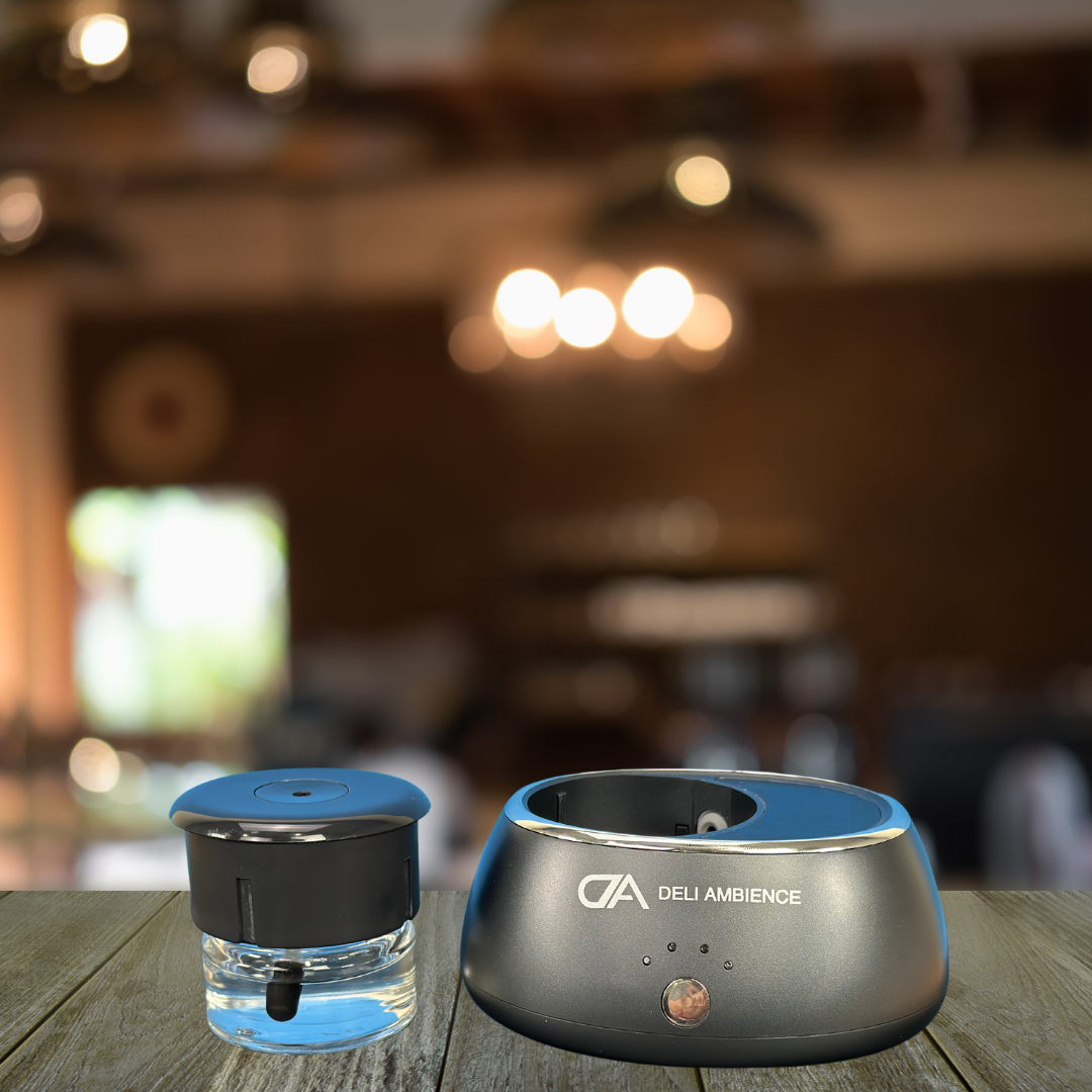 A DA Portable Scent Diffuser powered by solar energy sitting on a table next to a bottle of water.
