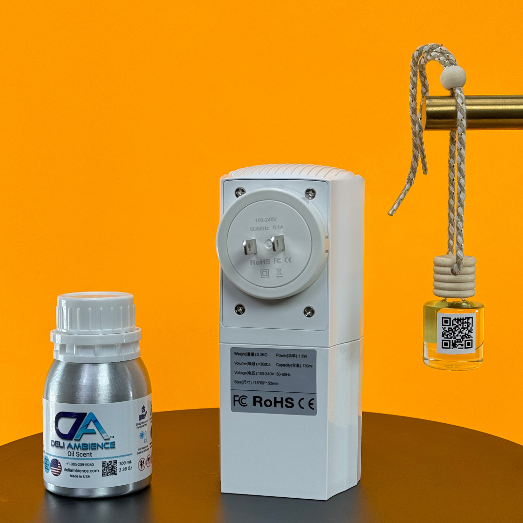The DA Plug In Diffuser with Sea Water Fragrance and Car Freshner features an electric diffuser and fragrance oil bottle on a black surface against an orange background, complemented by a hanging glass car air freshener with rope for a coastal touch.