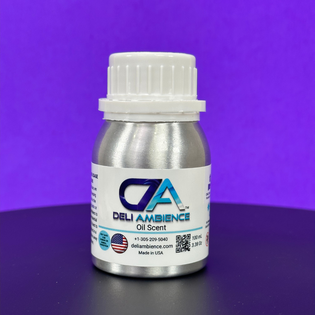 Small metallic bottle labeled "Deli Ambience 'DA Elegant' Oil Scent 100 ml" promises a luxury hotel scent, featuring contact information, a QR code, and "Made in USA." The bottle has a white cap and is displayed against a purple background, enhancing an elegant DA sensory experience.