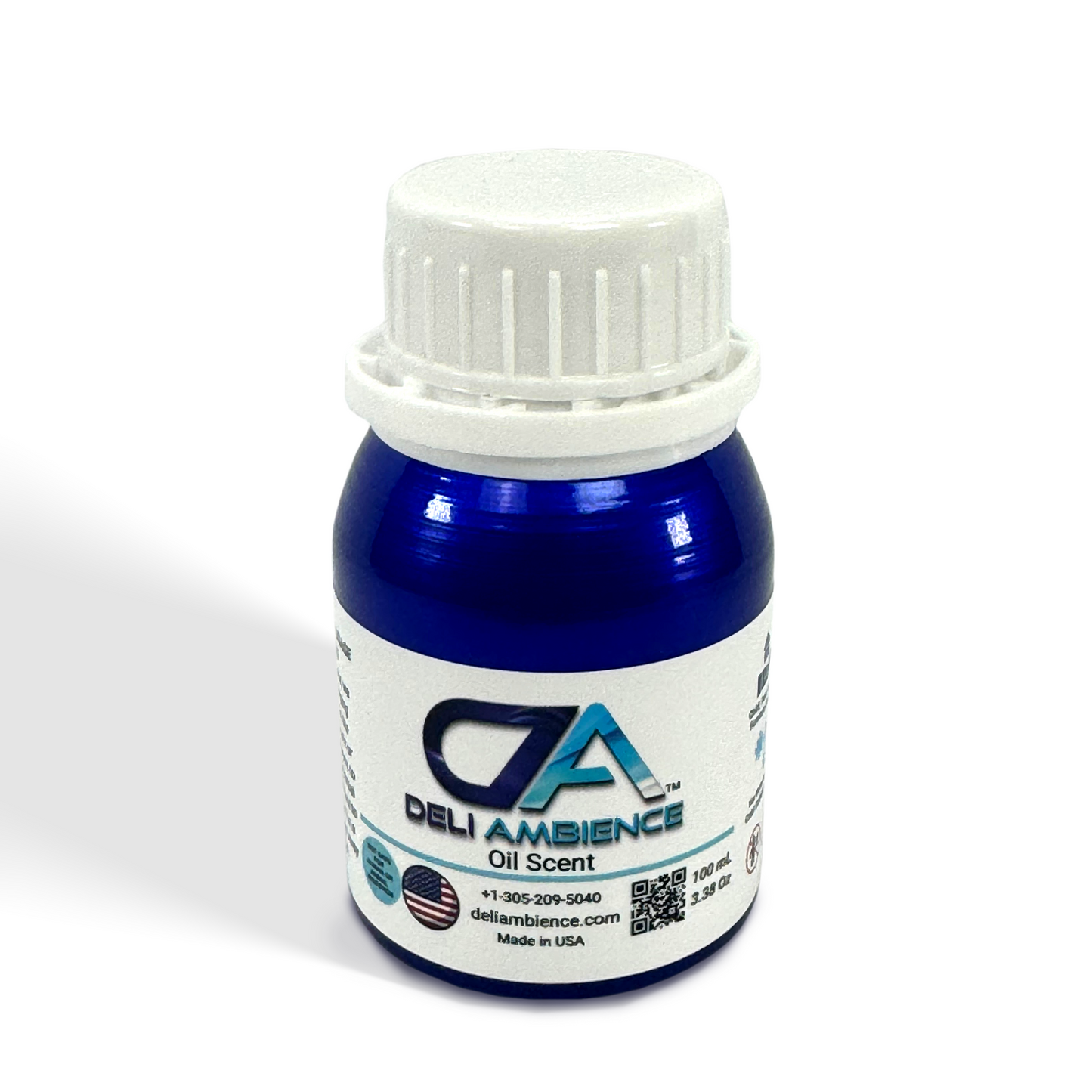 A small blue bottle of Deli Ambience "DA Elegant" Oil Scent 100 ml with a white cap, featuring the Elegant DA brand's logo and contact information. The bottle offers 3.38 oz (100 ml) of product, designed to evoke a luxury hotel scent for a refined sensory experience, and is made in the USA.