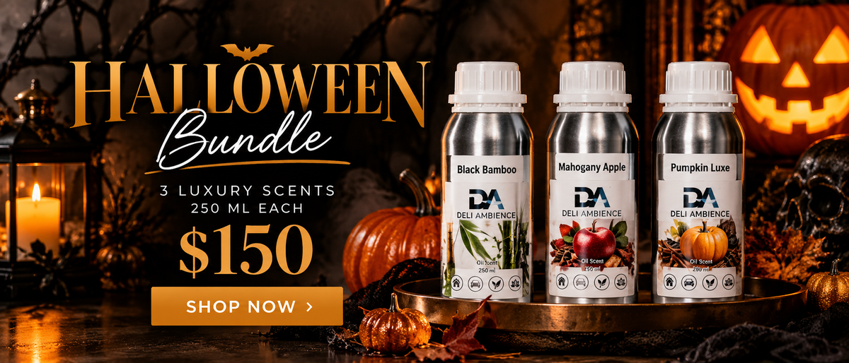The Halloween Bundle 3 Luxury Scents features three silver bottles of Black Bamboo, Mahogany Apple, and Pumpkin Luxe on a gold tray surrounded by pumpkins and Halloween decor.