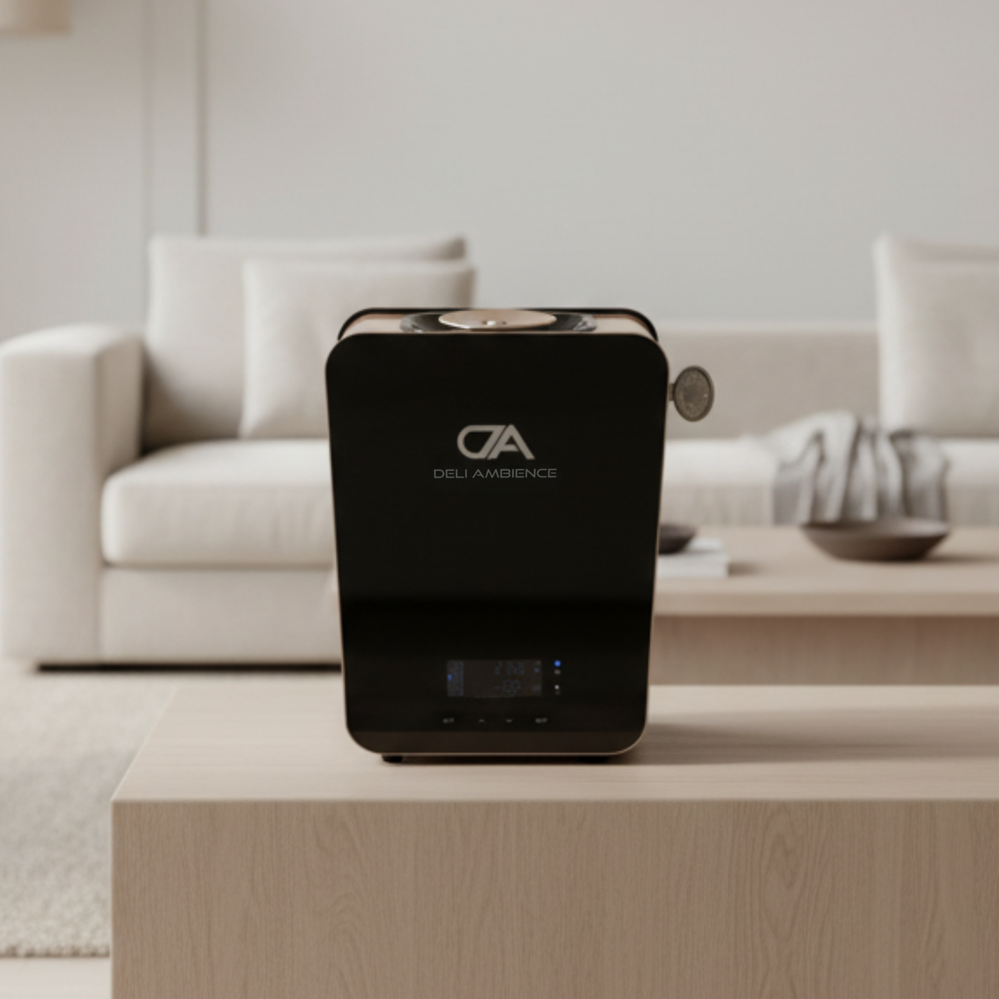 A black Vital Air Oil Scent Diffuser sits on a light wooden table in a modern living room with a beige sofa and minimal decor, ready to fill your space with essential oils and soothing fragrance.