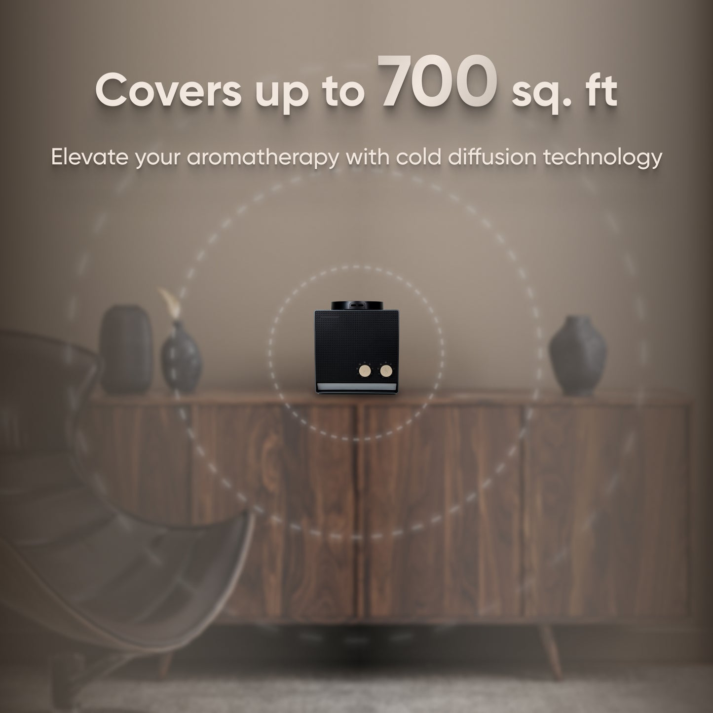 A DA Vintage Oil Diffuser in black, equipped with Bluetooth, sits elegantly on a wooden cabinet next to vases, providing aromatherapy benefits through its advanced cold diffusion technology and covering an area of up to 700 square feet.