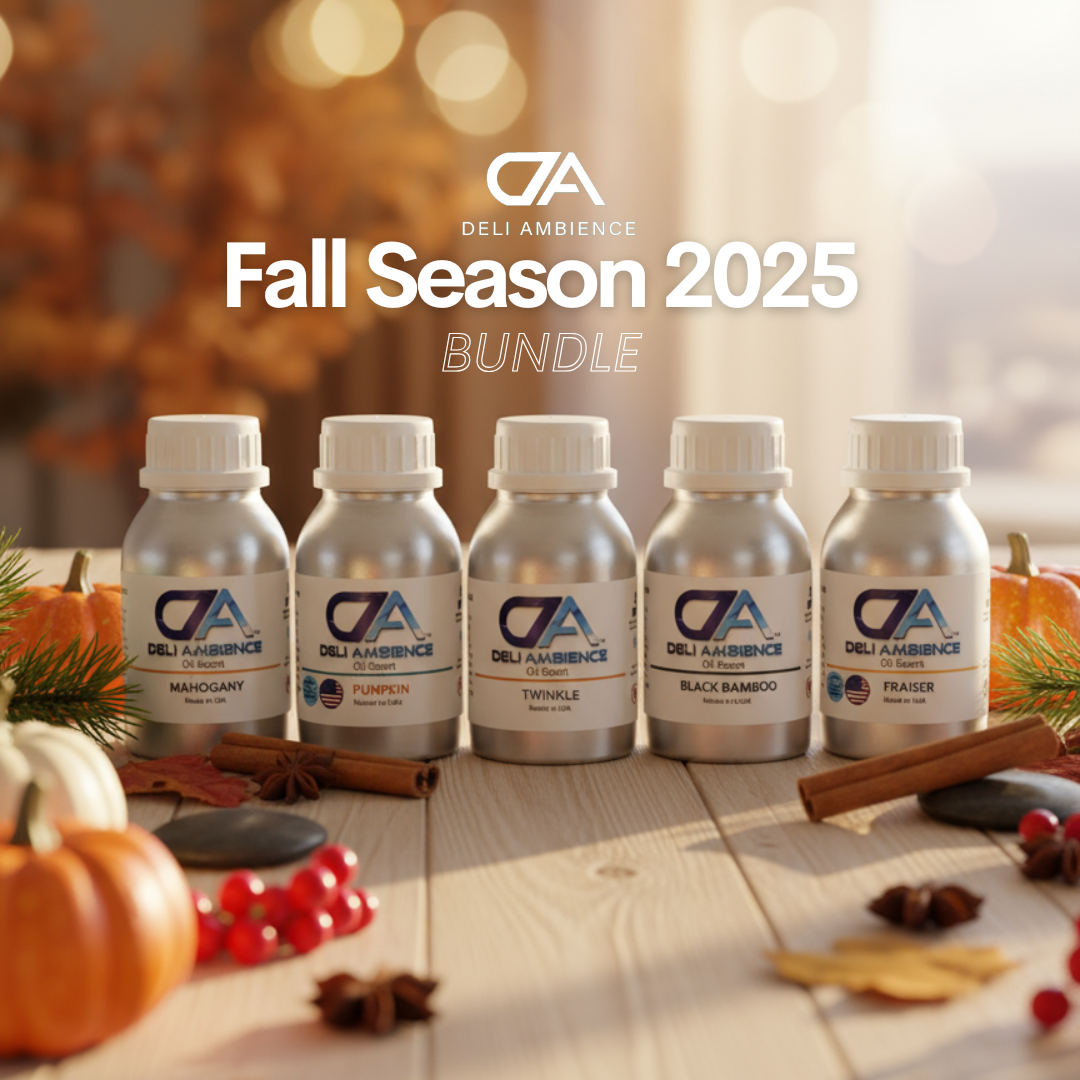 The Fall Season 2025 Bundle—five 100ml bottles—sits on a table with pumpkins, cinnamon sticks, and leaves, showcasing cozy autumn scents and festive fragrances.