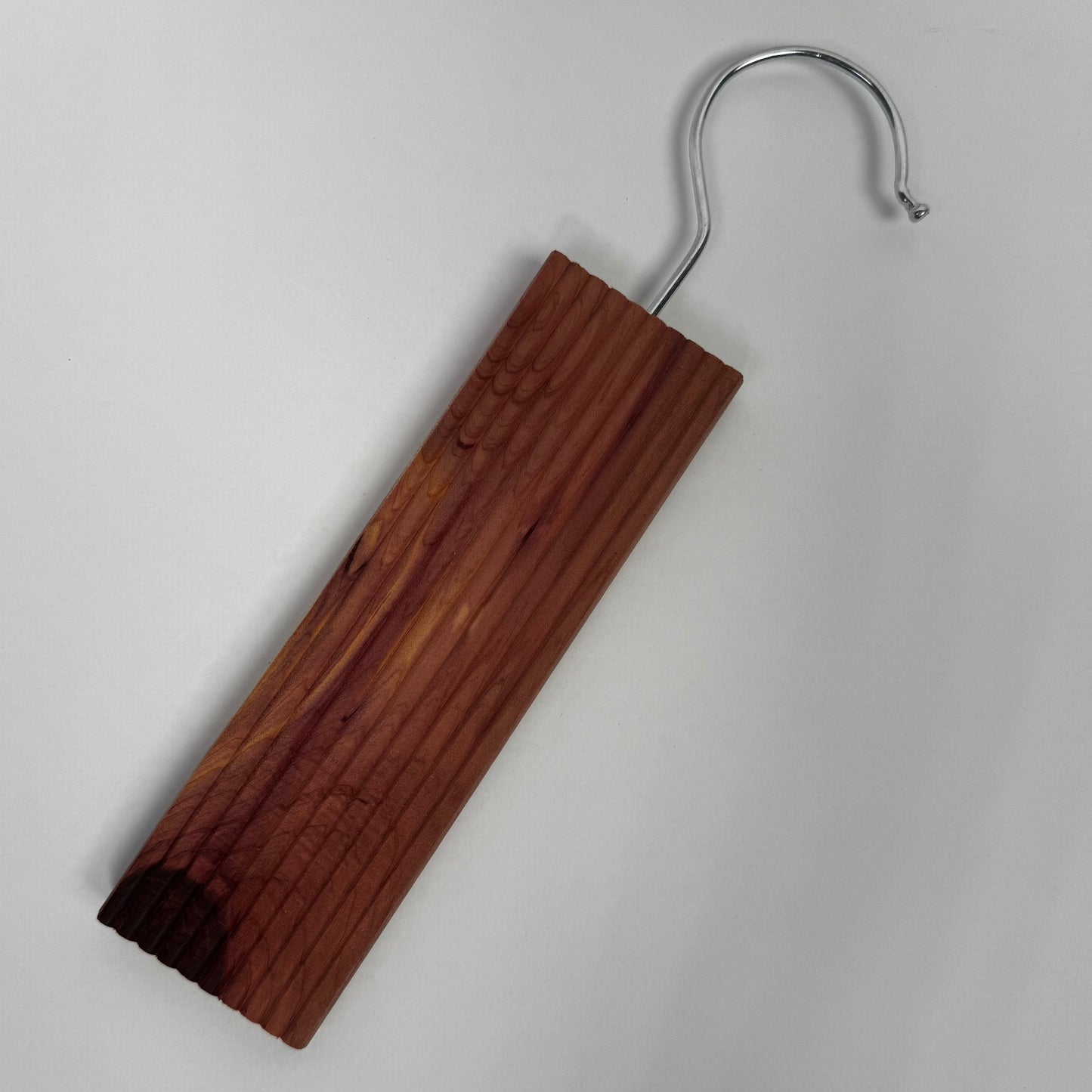 Scented Cedar Wood Hangups with Hook for Closets on a white background.