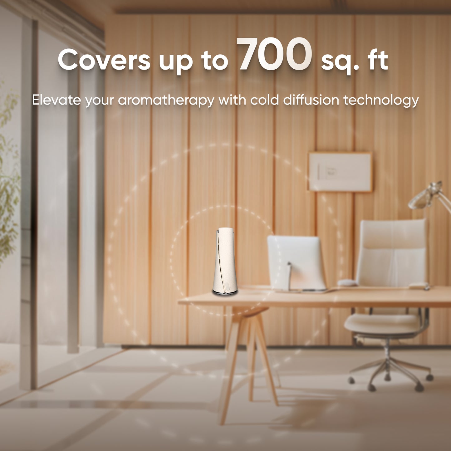 In a minimalist office setting, the stylish Volcano Oil Diffuser White - Bluetooth stands out, featuring text that reads: "Covers up to 700 sq. ft. Elevate your aromatherapy with cold diffusion technology, transforming your space into a calming oasis.