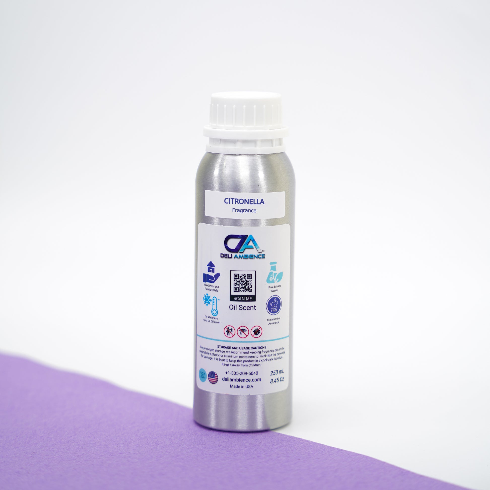 A bottle of Fresh Citronella Oil Scent with a pleasing aroma on a purple surface.